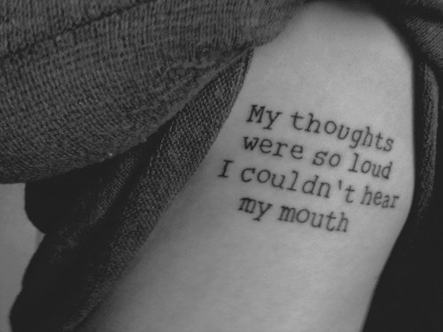 Black And White Quote Tattoo On Side